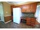 Kitchen features granite counters, cabinets, tiled backsplash, white refrigerator, and desk area at 1174 Orchard Dr, Fort Mill, SC 29715