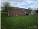 Spacious backyard with green grass and brick siding at 1217 Stony Point Rd, Kings Mountain, NC 28086