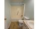 Bathroom with a shower-tub combo, toilet, and sink with neutral finishes at 1217 Stony Point Rd, Kings Mountain, NC 28086