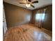 Bedroom with a ceiling fan, hardwood floors, and a window with curtains at 1217 Stony Point Rd, Kings Mountain, NC 28086