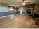 Open living room with hardwood floors, a fireplace, and entry to the kitchen at 1217 Stony Point Rd, Kings Mountain, NC 28086