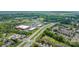 Aerial view of the community showcasing nearby retail shops and tree-lined streets at 12357 Copper Mountain Blvd, Charlotte, NC 28277