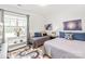 Bright bedroom featuring two beds, playful decor, and a large window with ample natural light at 12357 Copper Mountain Blvd, Charlotte, NC 28277
