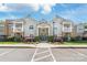 Attractive building exterior with well-maintained landscaping, inviting entrance, and ample parking spaces at 12357 Copper Mountain Blvd, Charlotte, NC 28277