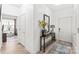 Welcoming entryway featuring neutral paint, decorative console table, and views to living spaces at 12357 Copper Mountain Blvd, Charlotte, NC 28277