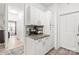 Bright coffee bar area with upper and lower white cabinets and decorative tile backsplash at 12357 Copper Mountain Blvd, Charlotte, NC 28277