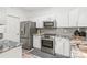 Stylish kitchen featuring stainless steel appliances and light gray granite countertops at 12357 Copper Mountain Blvd, Charlotte, NC 28277
