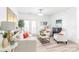 Bright and airy living room featuring modern decor and access to a private balcony at 12357 Copper Mountain Blvd, Charlotte, NC 28277