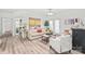 Open living area with neutral tones, hardwood floors, and ample seating at 12357 Copper Mountain Blvd, Charlotte, NC 28277