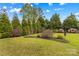 Expansive backyard featuring well-maintained lawn and landscaping offering private outdoor space at 12746 Bravington Rd, Huntersville, NC 28078