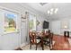 Charming dining area features natural light and a modern chandelier for an inviting atmosphere at 12746 Bravington Rd, Huntersville, NC 28078