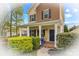 Charming two-story home with a welcoming front porch and well-manicured landscaping at 12746 Bravington Rd, Huntersville, NC 28078