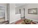 Bright upstairs hallway with hardwood floors that leads to several doors at 12746 Bravington Rd, Huntersville, NC 28078