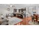 Open-concept kitchen featuring stainless steel appliances, granite countertops, and a kitchen island with seating at 12746 Bravington Rd, Huntersville, NC 28078
