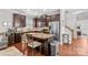 Stylish kitchen with stainless steel appliances, a central island, and hardwood floors at 12746 Bravington Rd, Huntersville, NC 28078