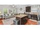 Bright kitchen with stainless steel appliances, a center island, and an open-concept layout at 12746 Bravington Rd, Huntersville, NC 28078
