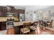 Modern kitchen with stainless steel appliances, granite countertops, and a breakfast bar with seating at 12746 Bravington Rd, Huntersville, NC 28078