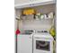 Convenient laundry room with a washer, dryer, and ample shelving for storage at 12746 Bravington Rd, Huntersville, NC 28078