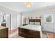 Spacious bedroom features a door to the outside, closet and a door to an ensuite bathroom at 12746 Bravington Rd, Huntersville, NC 28078