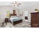 Comfortable bedroom featuring vaulted ceiling, wood floors, neutral colors and plenty of natural light at 12746 Bravington Rd, Huntersville, NC 28078