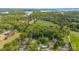 Stunning aerial view of a neighborhood featuring lush greenery, a pond, and well-maintained homes at 130 Hopedale Ct, Mooresville, NC 28117