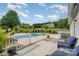 Inviting backyard featuring a fenced pool, patio seating, and a well-maintained lawn at 130 Hopedale Ct, Mooresville, NC 28117