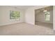 Bright bedroom with carpeted floors, neutral walls and natural light at 130 Hopedale Ct, Mooresville, NC 28117