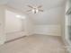 Carpeted bonus room with natural light and ensuite access, perfect for a play area at 130 Hopedale Ct, Mooresville, NC 28117