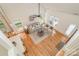 Bright living room with vaulted ceilings, fireplace, hardwood floors, and large windows at 130 Hopedale Ct, Mooresville, NC 28117