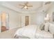 Comfortable main bedroom featuring neutral paint, carpet, and access to the ensuite bathroom at 130 Hopedale Ct, Mooresville, NC 28117