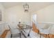 Bright home office featuring a wooden desk, white walls, and access to the hallway at 130 Hopedale Ct, Mooresville, NC 28117