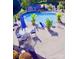 Inviting backyard pool area with lush landscaping, patio seating, and a shed for storage at 130 Hopedale Ct, Mooresville, NC 28117
