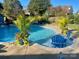 Inviting pool featuring a tanning ledge with blue lounge chairs and tropical landscaping at 130 Hopedale Ct, Mooresville, NC 28117
