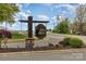 Community entrance sign for Pond Lane set against a bright blue sky at 130 Hopedale Ct, Mooresville, NC 28117