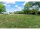 A spacious backyard features lush grass and a shed with plenty of open space at 1341 Hopewell Rd, Rock Hill, SC 29730