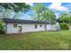 The home features a white exterior with a spacious green backyard at 1341 Hopewell Rd, Rock Hill, SC 29730