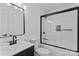 Clean bathroom featuring black framed shower with glass door, sink, and toilet at 1341 Hopewell Rd, Rock Hill, SC 29730