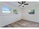 Bright bedroom with two windows and ceiling fan at 1341 Hopewell Rd, Rock Hill, SC 29730