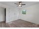 Empty bedroom featuring a window, ceiling fan, and large closet at 1341 Hopewell Rd, Rock Hill, SC 29730