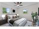 Cozy bedroom with neutral tones, featuring two windows, and a ceiling fan at 1341 Hopewell Rd, Rock Hill, SC 29730