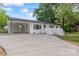 Charming home with a white exterior, carport, and well-manicured front yard at 1341 Hopewell Rd, Rock Hill, SC 29730