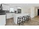 Modern kitchen featuring white cabinets, stainless steel appliances, and a large center island with seating at 1341 Hopewell Rd, Rock Hill, SC 29730