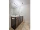 Bathroom featuring a double sink vanity with modern fixtures and a large mirror at 1430 Eastway Dr, Dallas, NC 28034