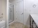 Bathroom with a glass-enclosed shower, single vanity, and tile floors at 1430 Eastway Dr, Dallas, NC 28034