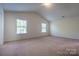Bedroom featuring carpet flooring, base trim and windows at 1430 Eastway Dr, Dallas, NC 28034