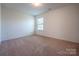 Bedroom featuring neutral carpet and a bright window at 1430 Eastway Dr, Dallas, NC 28034