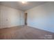 Empty bedroom featuring neutral carpet and white walls at 1430 Eastway Dr, Dallas, NC 28034
