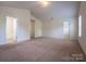 Spacious carpeted bonus room with high ceilings and natural light at 1430 Eastway Dr, Dallas, NC 28034