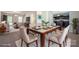 A staged dining room features a glass table, seating for six, and decorative serving ware at 1430 Eastway Dr, Dallas, NC 28034