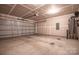 Spacious two car garage with concrete floor and unfinished drywall, ready for customization at 1430 Eastway Dr, Dallas, NC 28034
